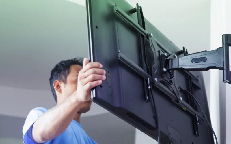 Proper installation of a heavy-duty wall mount bracket to prevent screen damage, advised by the best TV repair in Hyderabad.
